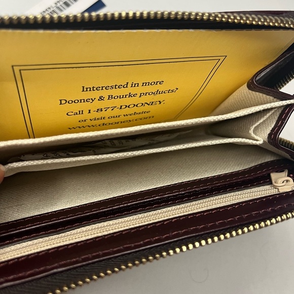 Dooney and Bourke Wexford Leather Zip Around Phone Wristlet Clutch - Bordeaux